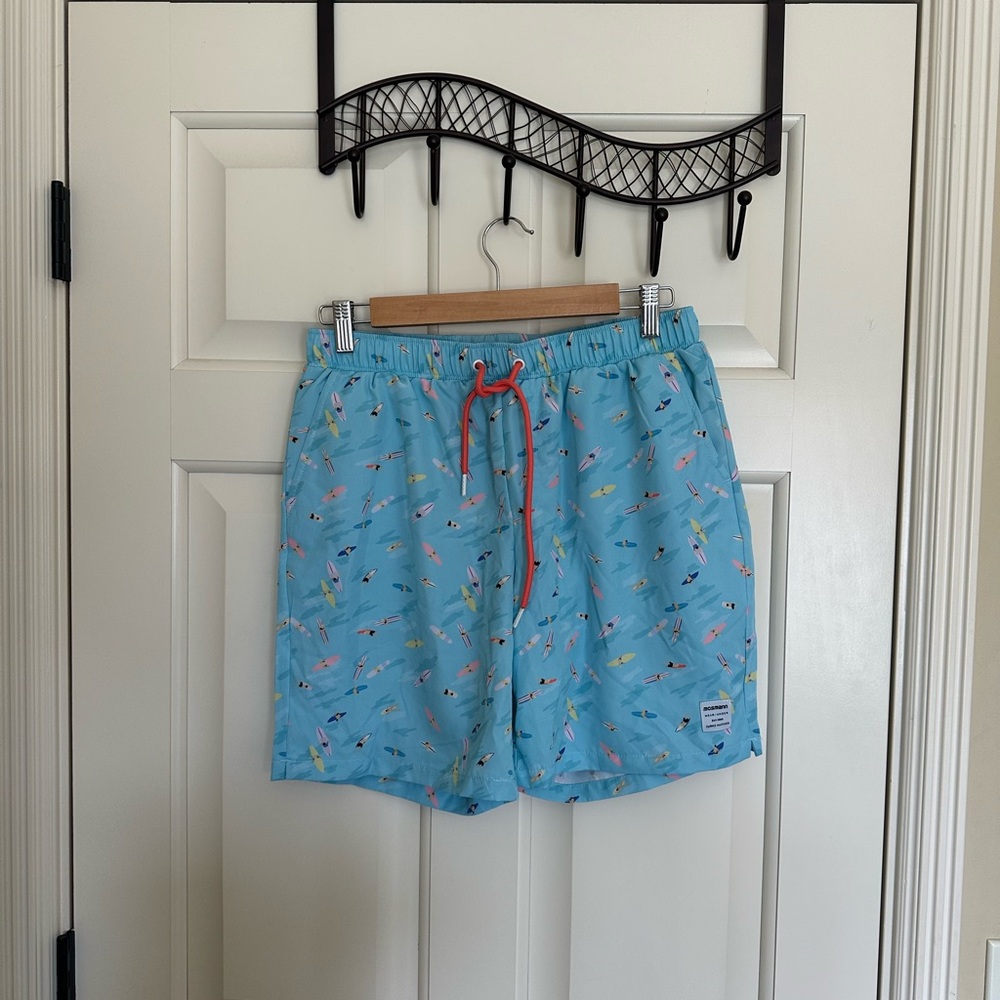 Light Blue Men's Swim Trunks with Surfer Print